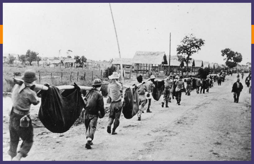 American WW2 soldiers buring soldiers kia during the Bataan Death March